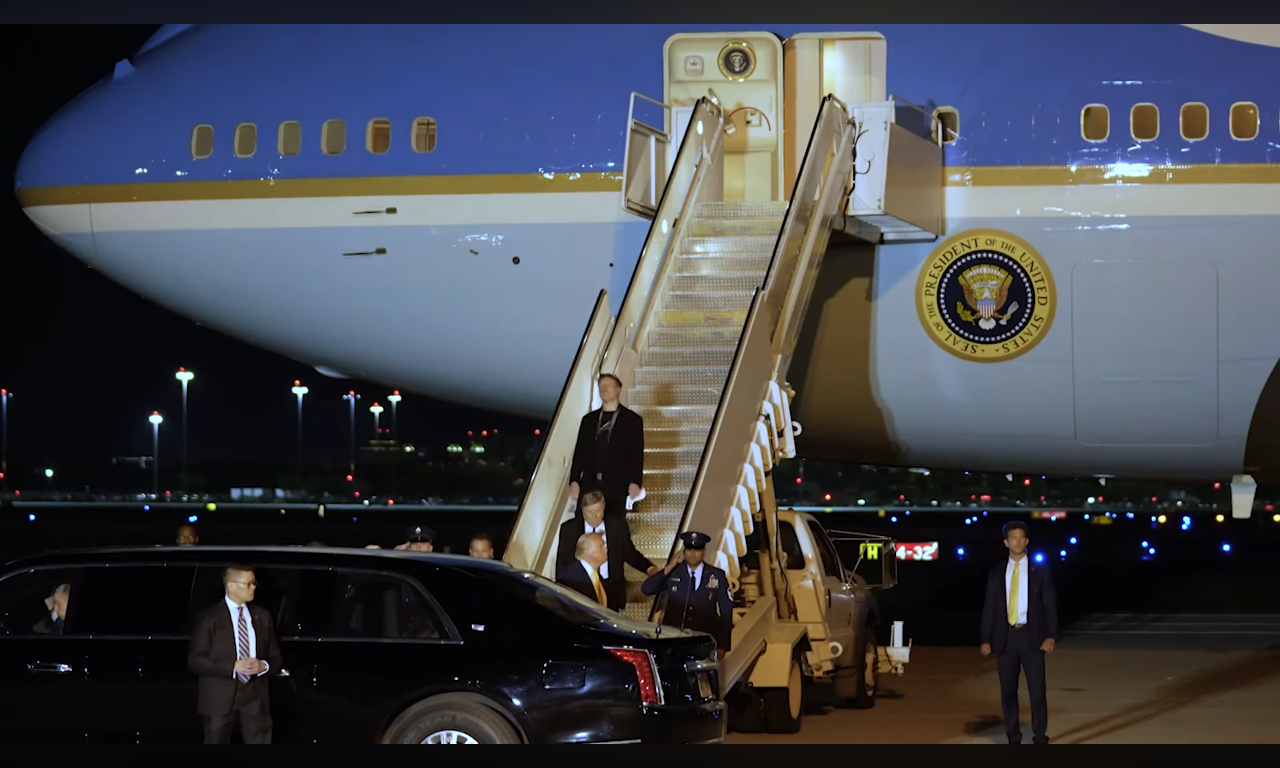 Elon Musk descends Air Force One with the President, inauguration period 2025. Presidential seal visible on fuselage.